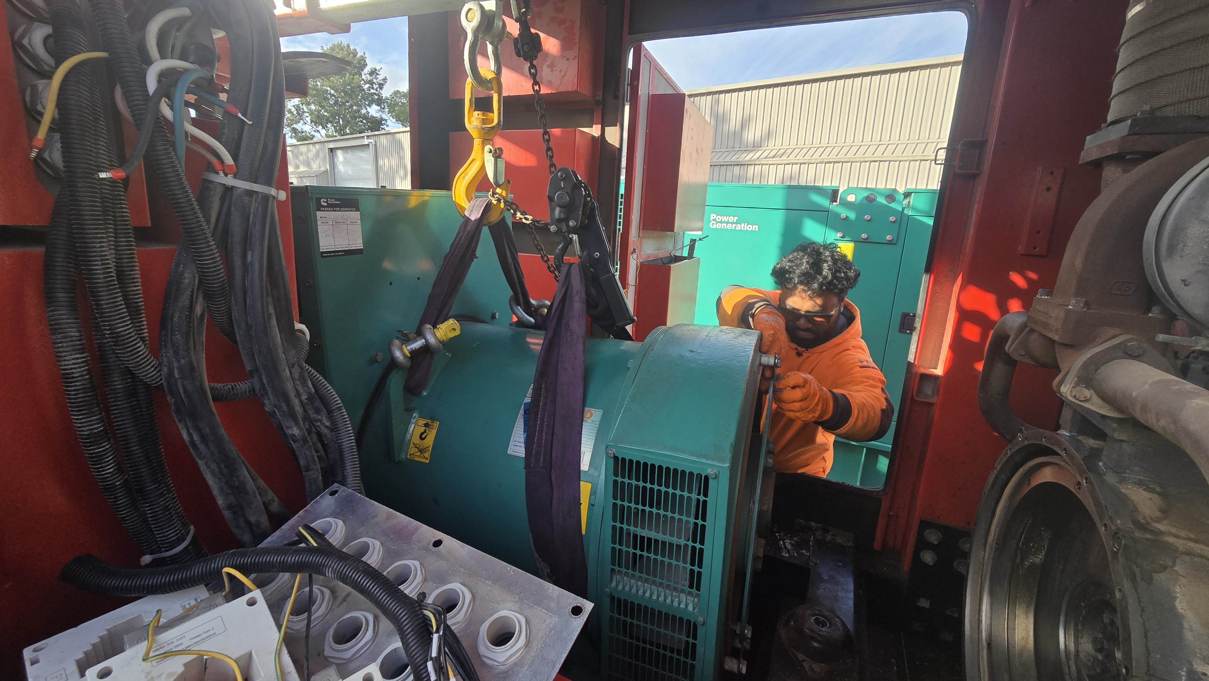 Motive Group technician servicing a generator on site